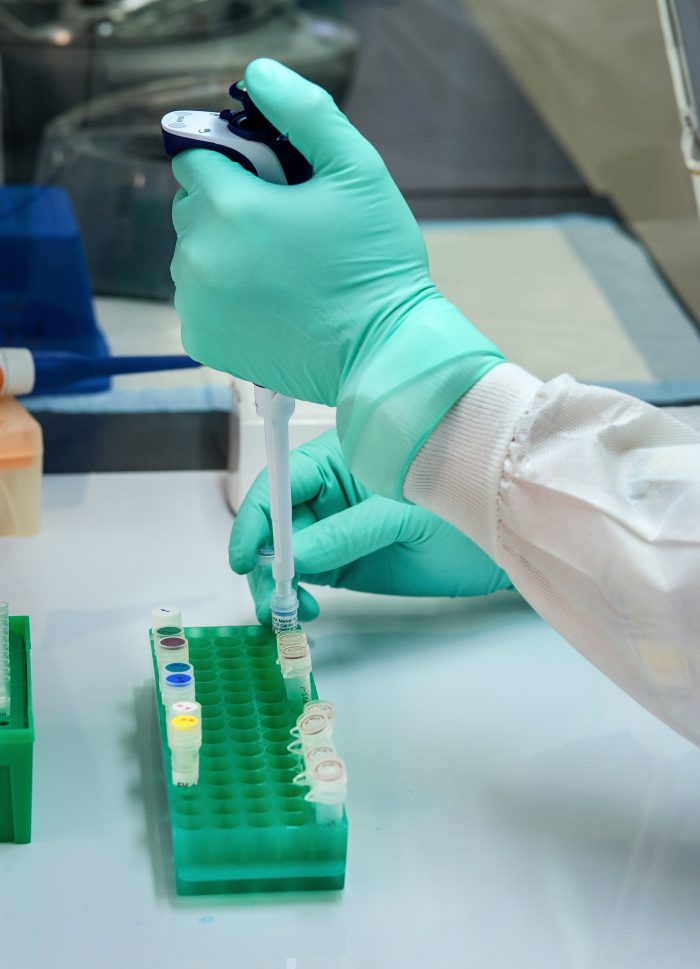 Close up of someone's hands in surgical gloves